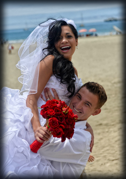 Wedding photo of happy bride and groom at a deatination wedding at sandbridge in virginia beach . A Virginia beach bride . Is enjoying all the fun of her  Virginia beach wedding photography .